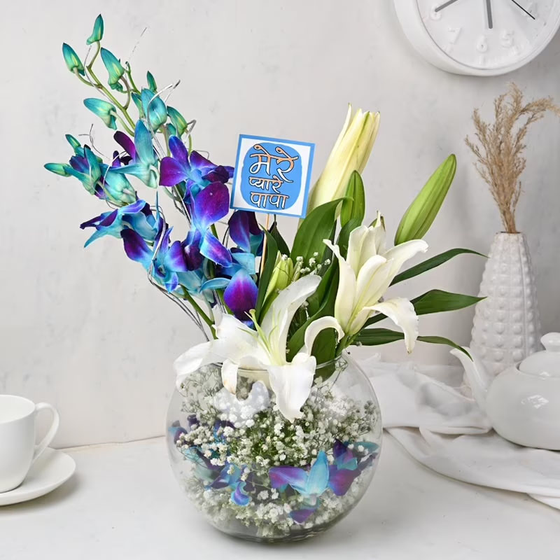 Send Beautiful White Lilies and Blue Orchids in Glass Vase Online ...
