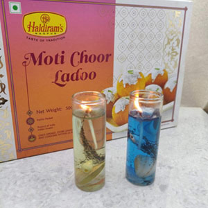 Tall glass candles with motichoor ladoo