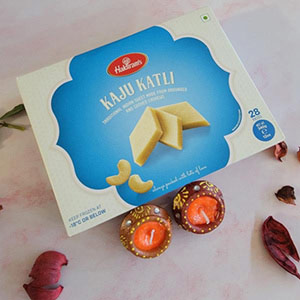 Delicious kaju katli with two diyas combo