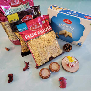 combo pack of three haldiram namkeen with diyas , ganesh idol and kaju katli