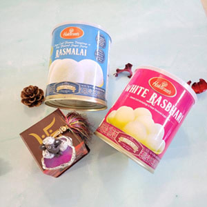 pretty ganesh idol with rasmalai and ras bhari gift pack