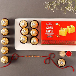 Sneh Rose Gold Rakhi With Soan Papdi & Ferrero Rocher