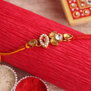 Intricate Oval Designer Golden Rakhi