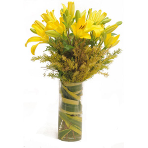 Decorative Yellow Lilies in Glass Vase