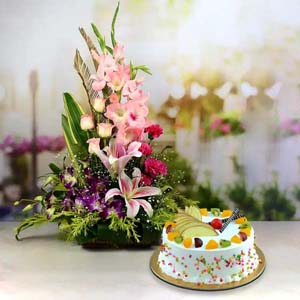 Pink and Purple Mix Flowers in Basket with Vanilla Fruit Cake