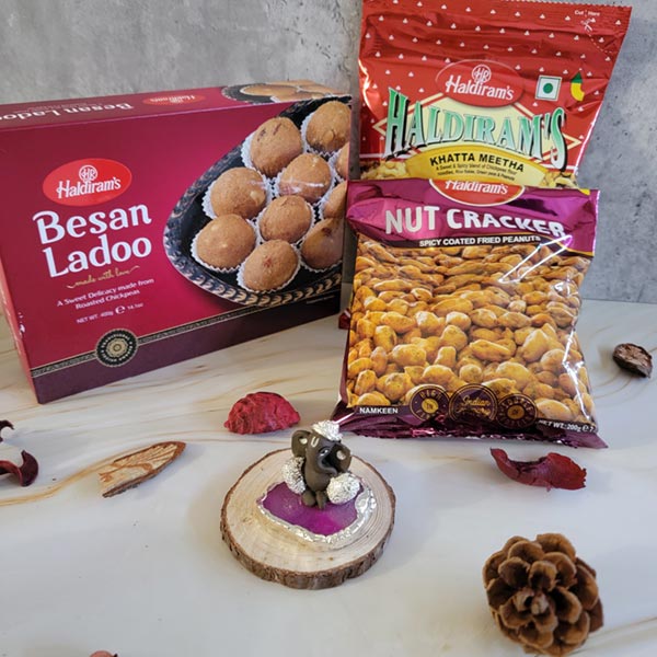 Send Besan ladoo with haldiran namkeen and Ganesh idol Online