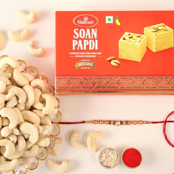 Send Sneh Rose Gold Rakhi With Soan Papdi & Cashews Online