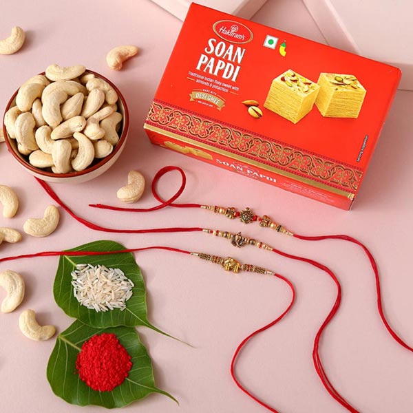 Send Sneh Feng Shui Rakhi Set With Soan Papdi & Cashews Online