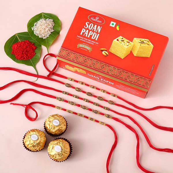 Send Sneh Charming Rakhis With Soan Papdi & Ferrero Rocher Online