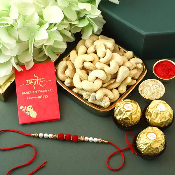 Send Sneh White Pearls Rakhi With Cashews & Ferrero Rocher Online
