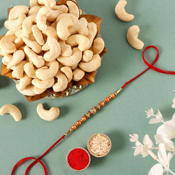Send Sneh Rose Gold Rakhi & Cashews Online