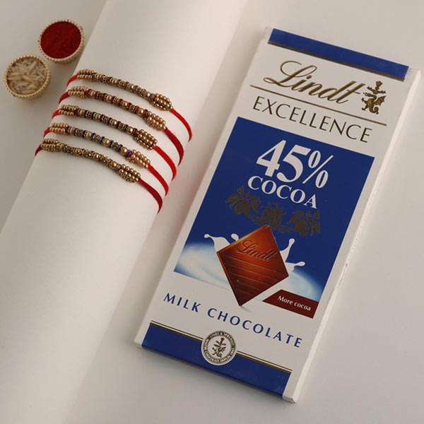 Send Sneh Colourful Pearl Rakhi Set & Lindt Bar Online