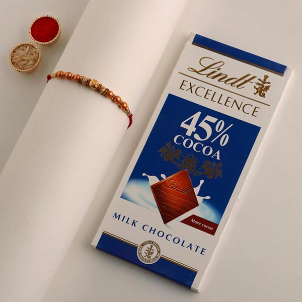 Send Sneh Rose Gold Rakhi & Lindt Bar to Qatar Online