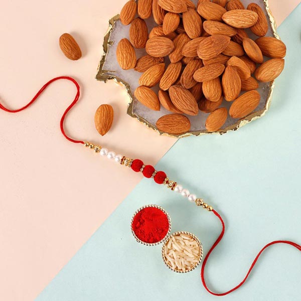 Send Sneh Pretty Beads Rakhi & Almonds Online