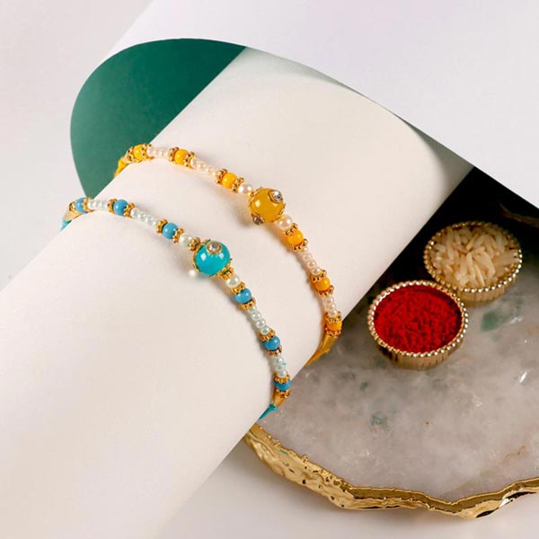 Send Sneh Vibrant Set Of 2 Pearl Rakhis Online