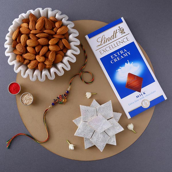 Send Sneh Ganesha Rakhi With Sweet Treats to Qatar Online