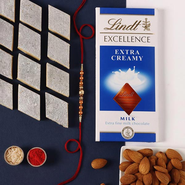 Send Sneh Rose Gold Rakhi With Sweet Treats Online