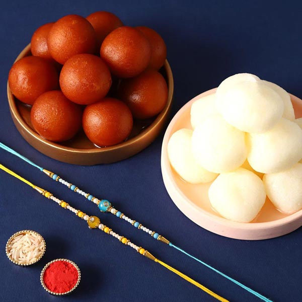 Send Sneh Vibrant Pearl Rakhis With Gulabjamun & Rasgullas Online
