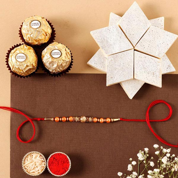 Send Sneh Rose Gold Rakhi & Sweet Delights Online