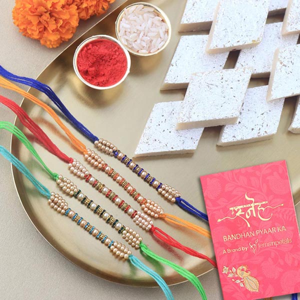 Send Sneh Colourful Pearl Rakhi Set & Kaju Katli Online