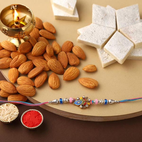 Send Sneh Peacock Feather Rakhi With Kaju Katli & Almonds Online