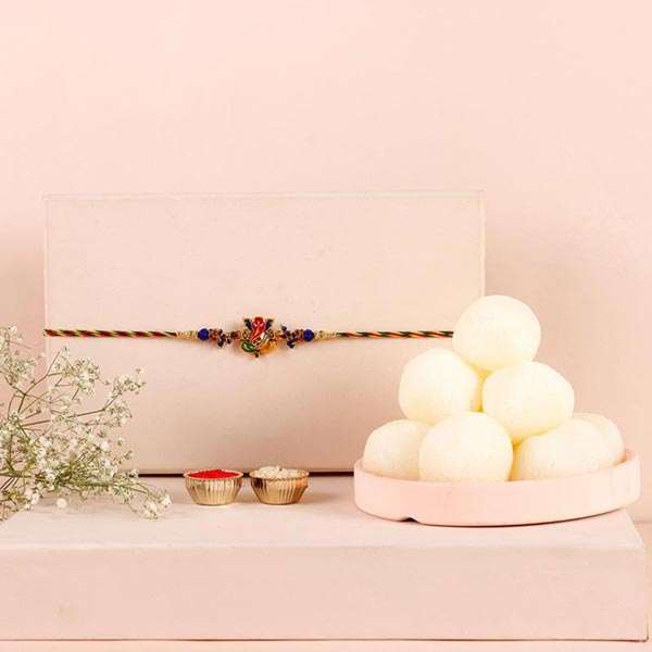 Send Sneh Auspicious Ganesha Rakhi & Rasgullas Online