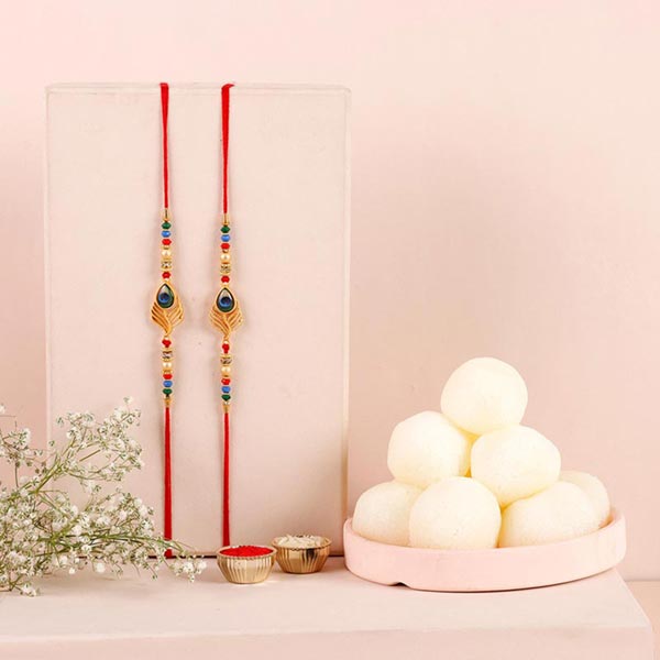 Send Sneh Peacock Feather Rakhi & Rasgullas Online