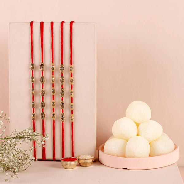 Send Sneh Brass Rakhi Set & Rasgullas Online