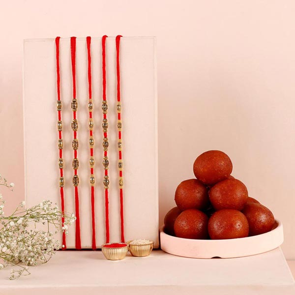 Send Sneh Brass Rakhi Set & Gulab Jamun Online