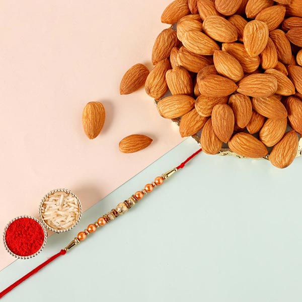 Send Sneh Rose Gold Rakhi & Almonds Online