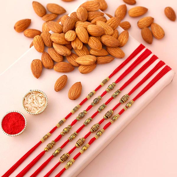 Send Sneh Brass Rakhi Set & Almonds Online