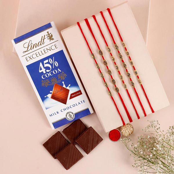 Send Sneh Brass Rakhi Set & Lindt Bar Online