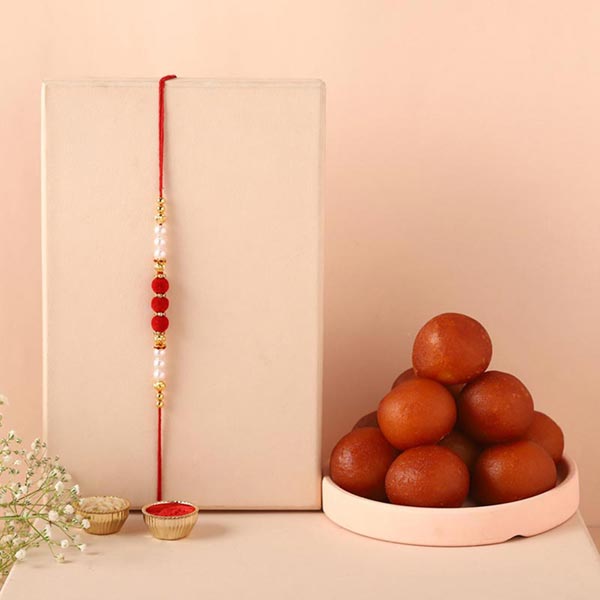 Send Sneh White Pearl Rakhi & Gulab Jamun Online