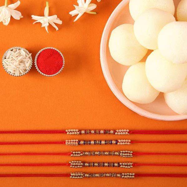 Send Sneh Colourful Pearl Rakhi Set & Rasgullas Online