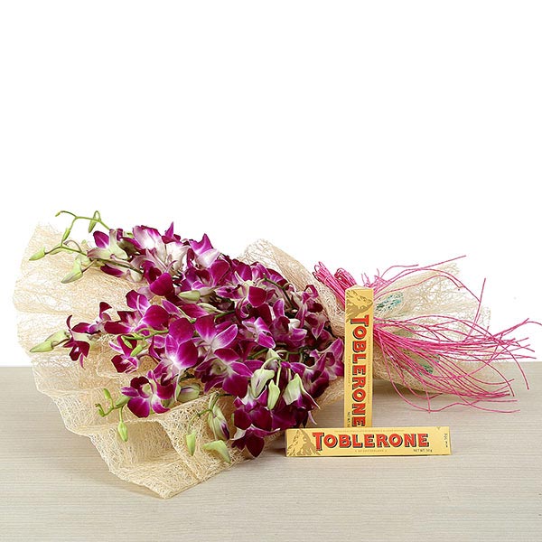 Send Purple Orchids in Jute Wrapping N Toblerone Chocolates Online