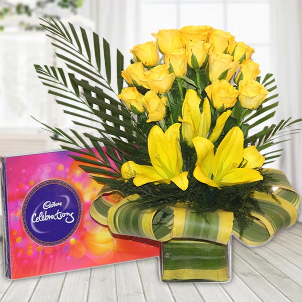 Send Yellow Roses N Lilies in Glass Vase with Chocolates Online